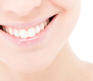 A woman who has had a teeth whitening procedure